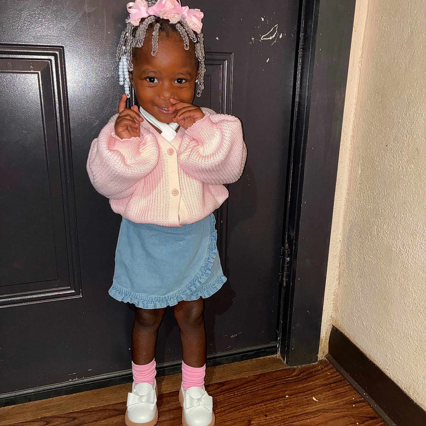 Jorydnn joined the competition — help win amazing prizes! child, girl, pink_sweater, denim_skirt, white_shoes, bows, hair_beads, pink_ribbons, standing, door, wooden_floor, indoor, smiling, cute, shy, fashion, portrait, person, happy, young