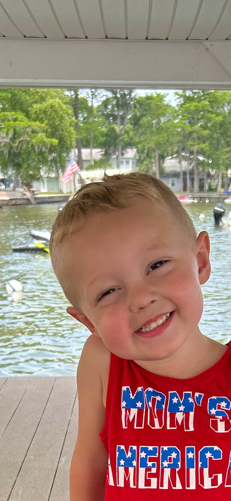 Gunner is registered to the contest to win money with this photo: baby, cheek, child, eye, fun, grass, happy, joy, lake, laugh, leisure, lip, nose, person, recreation, skin, smile, toddler, travel, tree