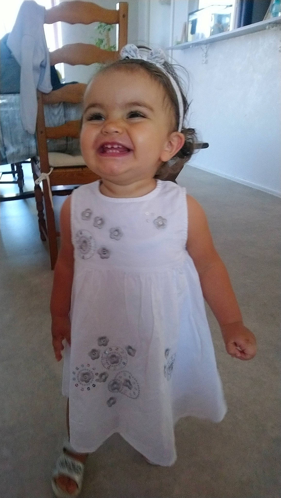 Gabriela participe au concours pour gagner de l'argent avec cette photo : baby, baby_toddler_clothing, child, dress, iris, joy, person, skin, smile, toddler