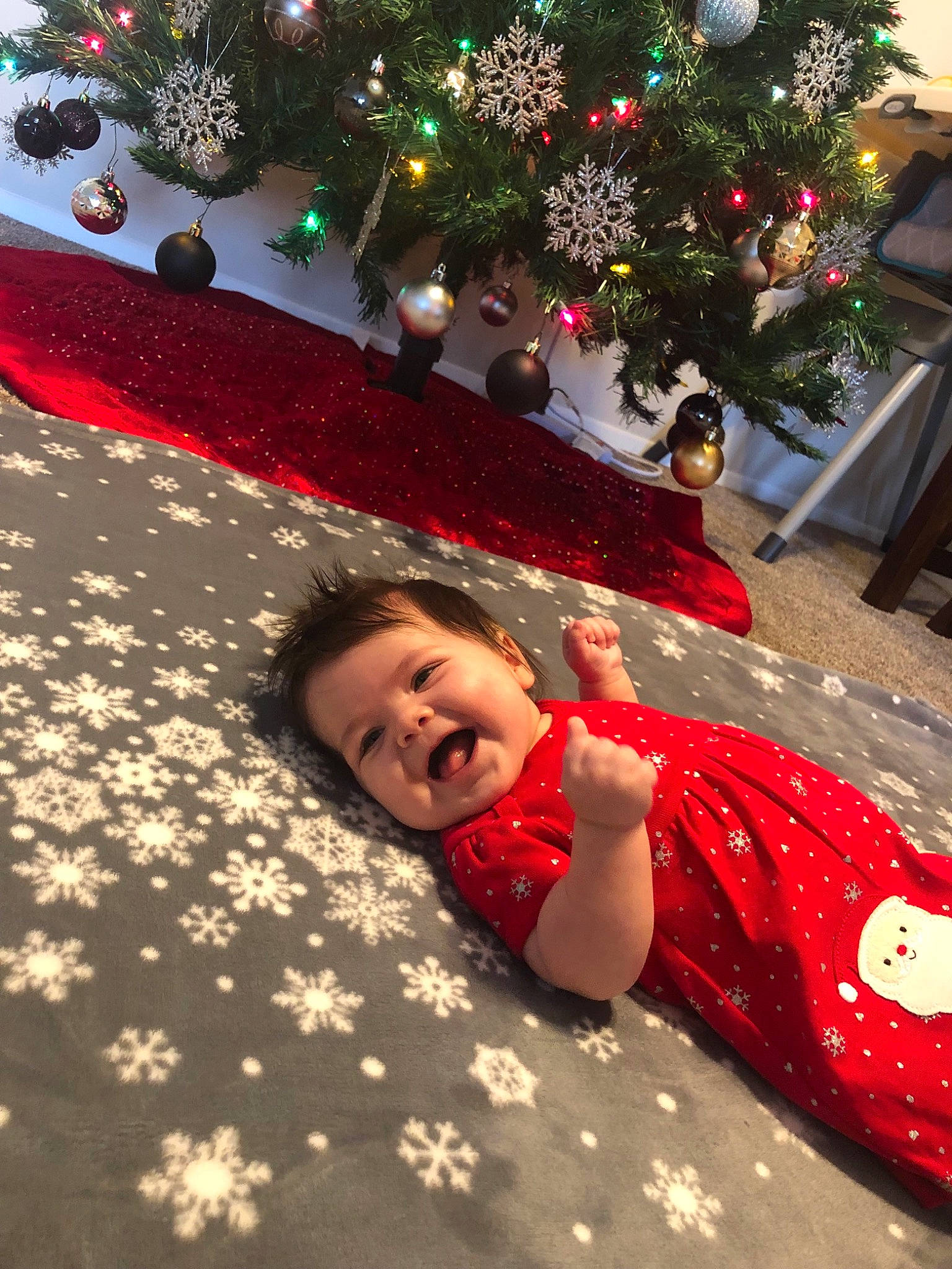 Avaya is registered to the contest to win money with this photo: christmas, christmas_decoration, event, fun, girl, holiday, leisure, person, plant, red, tree