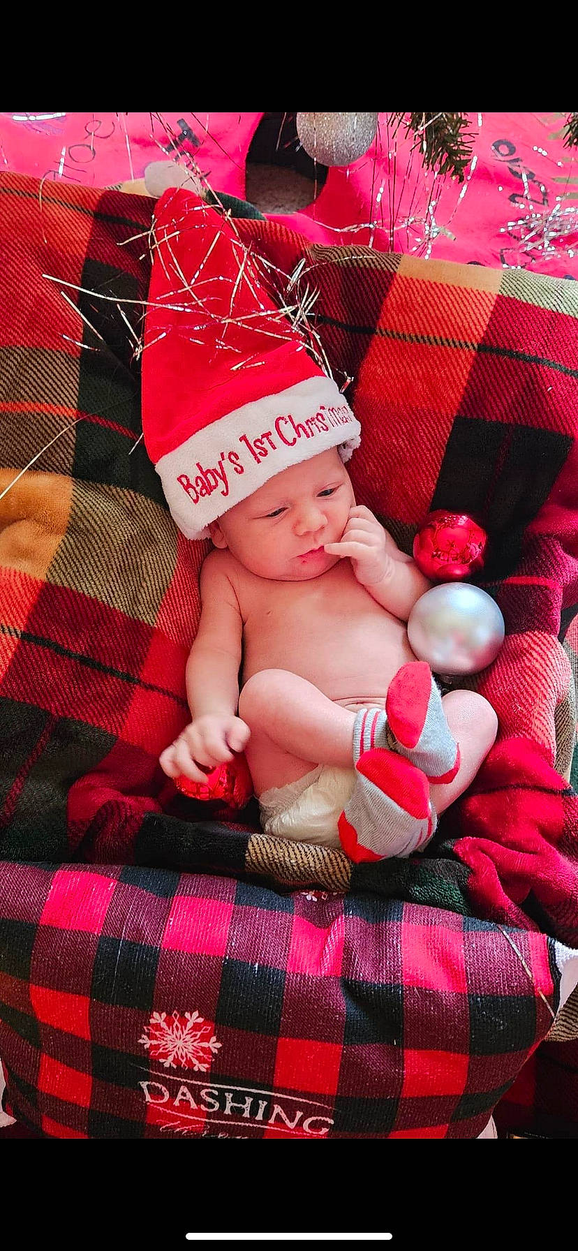 Easton joined the competition — help win amazing prizes! baby, baby_toddler_clothing, cap, child, comfort, costume_hat, event, finger, fun, happy, headwear, holiday, pattern, person, pink, plaid, red, skin, tartan, textile