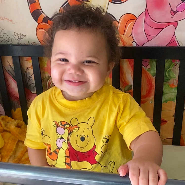 Hardy is registered to the contest to win money with this photo: baby, babylaughing, bed, clothing, crib, cushion, face, furniture, happy, head, homedecor, indoors, infantbed, laughing, person, photography, portrait, railing, smile, t_shirt