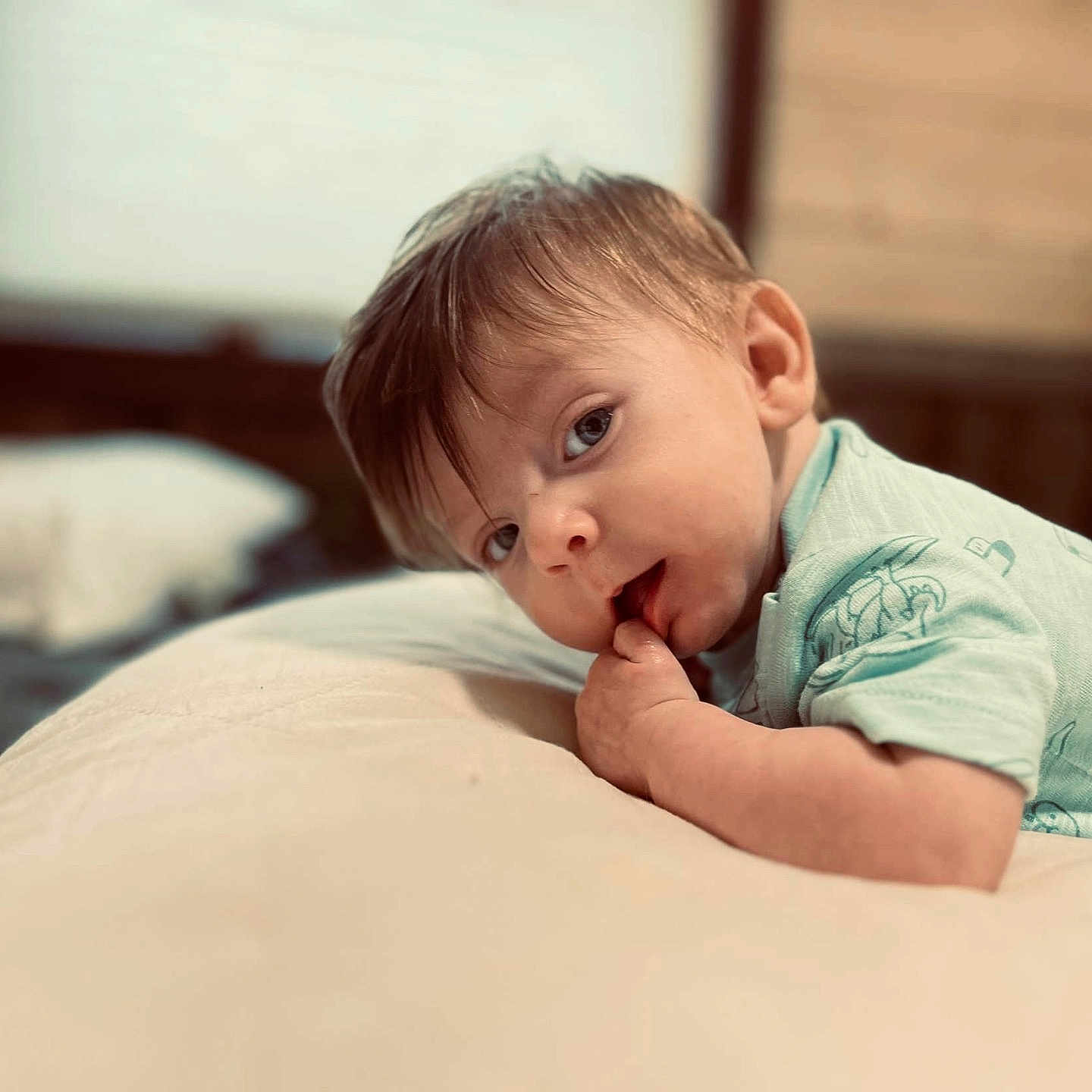 Wyatt is registered to the contest to win money with this photo: baby, biting, face, happy, head, newborn, person, photography, portrait, sad, smile