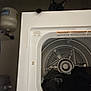 Zekrom joined the competition — help win amazing prizes! cat, black_cat, dryer, laundry_room, clothes, appliance, paw, indoor, peek, curious, dark, household, fabric, metal, door, home, shadow, quiet, resting, cleaning