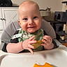 baby, child, infant, high_chair, smiling, eating, melon, fruit, food, bib, hands, portrait, indoor, home, kitchen, cat, furniture, tray, happy, close_up