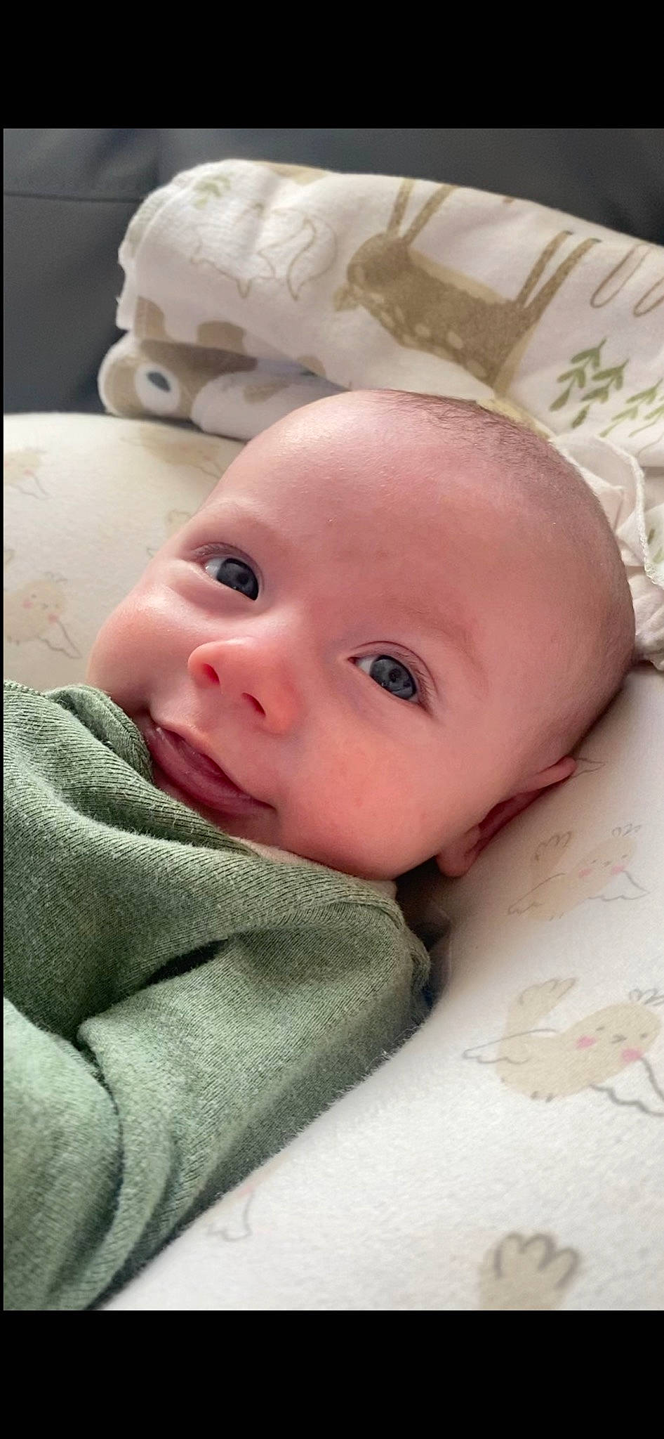 Liam is registered to the contest to win money with this photo: baby, baby_toddler_clothing, bedding, cheek, child, chin, comfort, happy, iris, linens, lip, nose, person, portrait_photography, skin, sleeve, smile, toddler