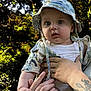 Rareș Gabriel a rejoint le concours — aidez-le/la à gagner de superbes lots ! baby, casual_clothing, child, cute, forest, greenery, hands, hat, holding, infant, nature, outdoor, person, portrait, skin, summer, sunlight, tattoo, trees, young