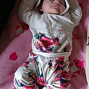 Kinley joined the competition — help win amazing prizes! baby, sleeping, infant, child, portrait, lying_down, pink_blanket, floral_clothing, hood, onesie, socks, peaceful, indoors, bed, nursery, cute, face, closed_eyes, textile, photography