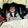 Kinley joined the competition — help win amazing prizes! baby, child, smiling, shopping_cart, car_seat, blanket, bundled, infant, portrait, indoors, store, safety_harness, clothing, happy, face, eyes, hair, baby_carrier, cozy, photography