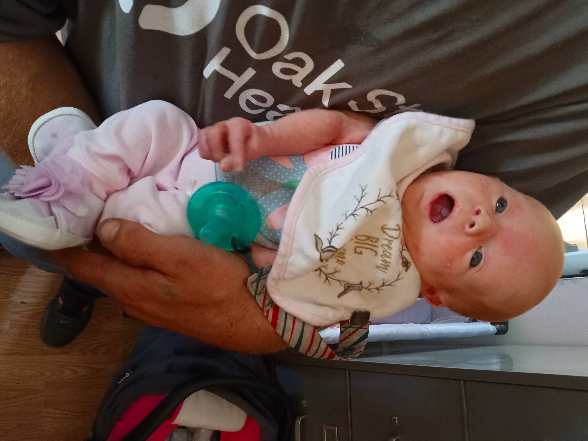 Lydia is registered to the contest to win money with this photo: baby, baby_products, baby_safety, baby_toddler_clothing, backpack, child, drinkware, event, finger, hand, nail, person, pink, room, stuffed_toy, textile, thumb, toddler, wrist