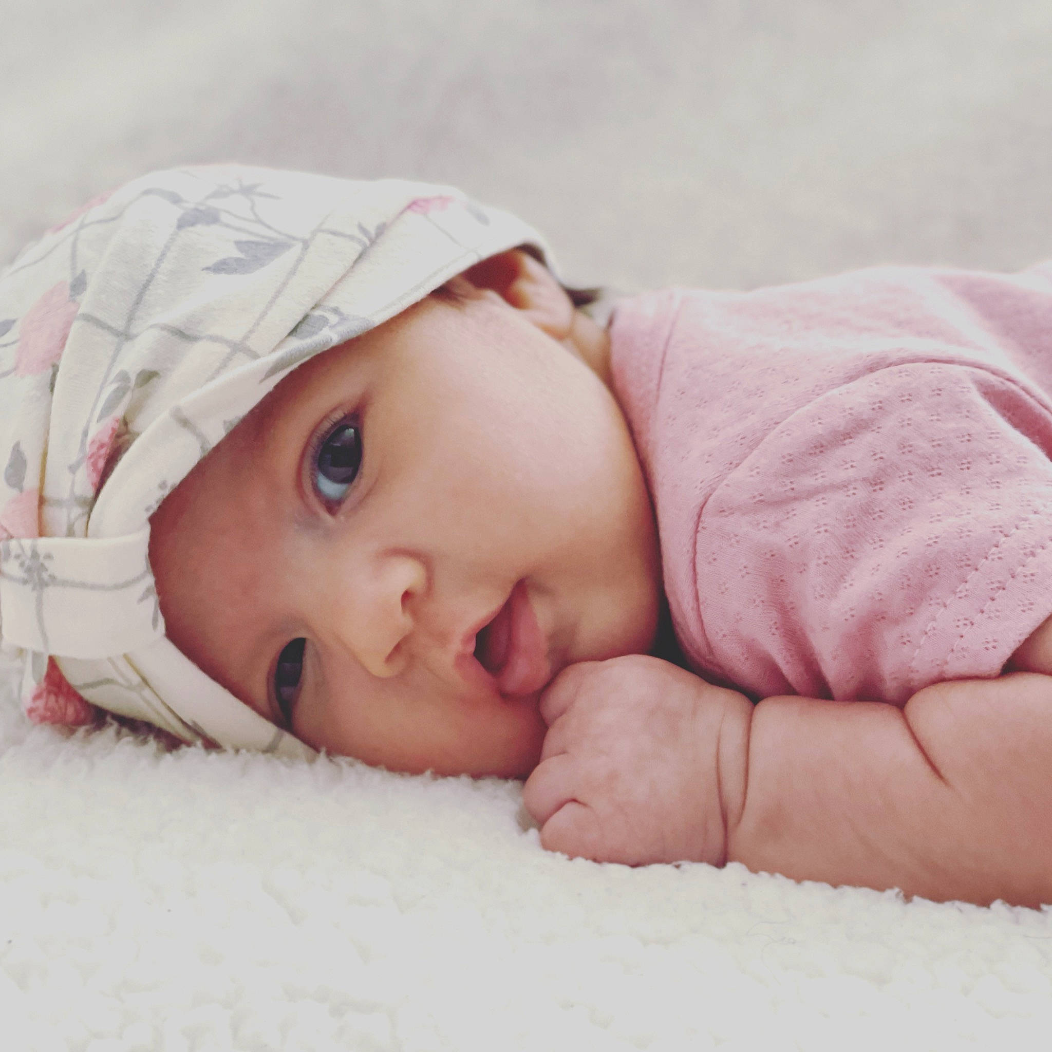 Harper is registered to the contest to win money with this photo: baby, baby_sleeping, baby_toddler_clothing, cap, cheek, child, comfort, eyebrow, eyelash, fashion_accessory, fur, grass, happy, headwear, knit_cap, linens, lip, nose, person, skin