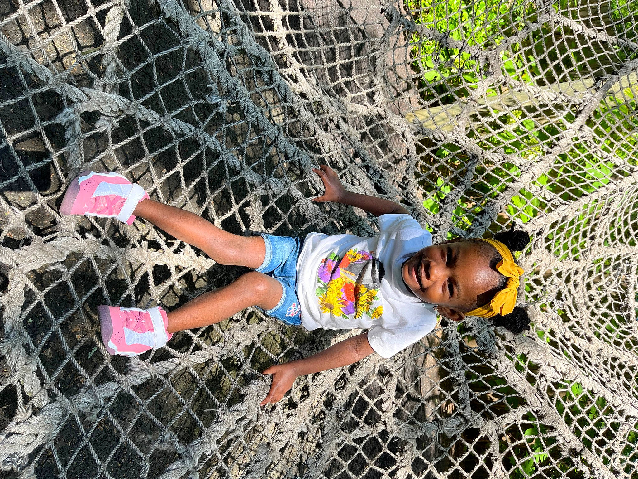 Leighton joined the competition — help win amazing prizes! chain_link_fencing, fence, fun, grass, human_leg, joy, leisure, line, mesh, net, pattern, people_in_nature, person, plant, recreation, shorts, soil, thigh, toddler, tree