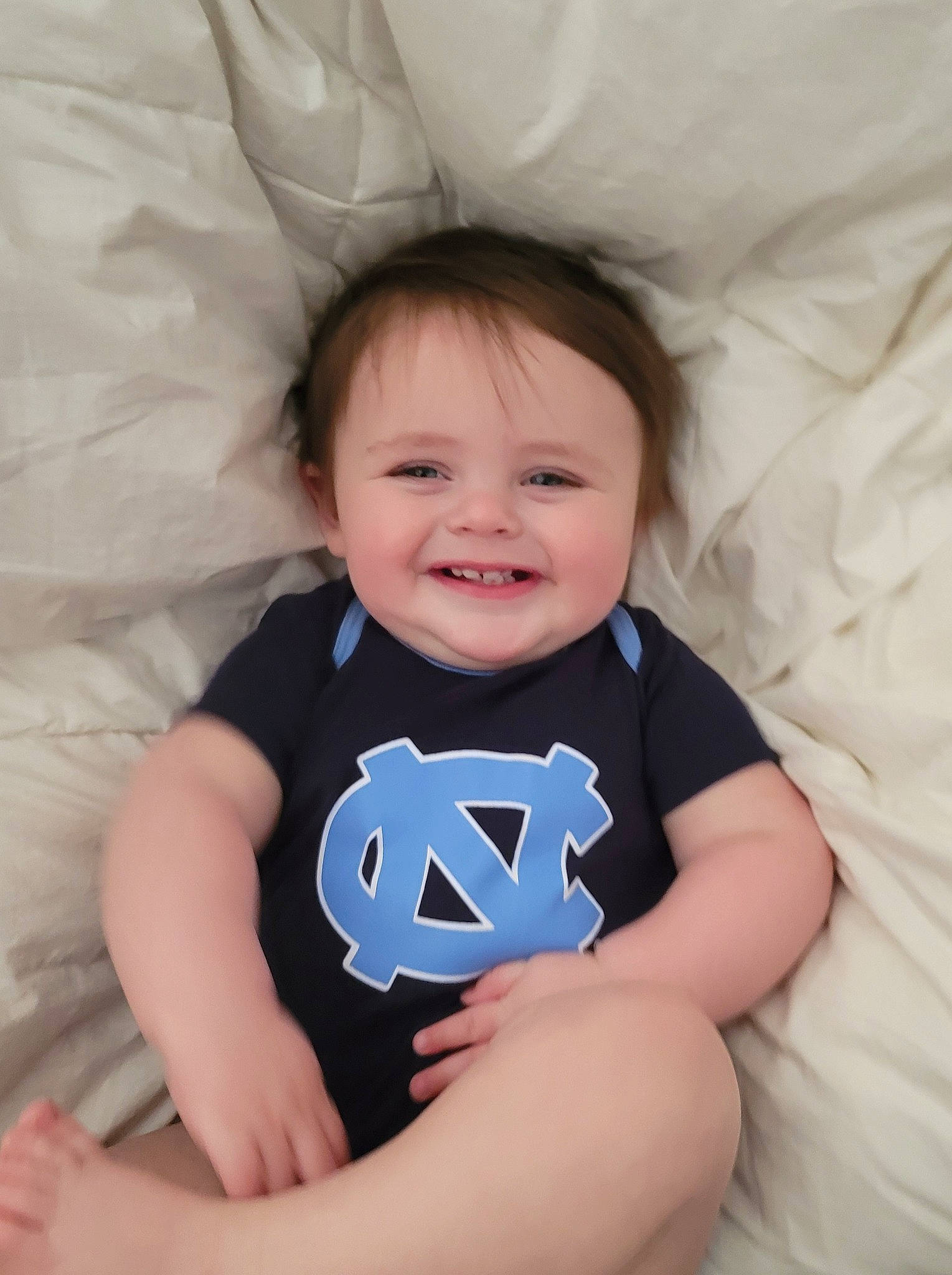 Chase is registered to the contest to win money with this photo: arm, azure, baby_toddler_clothing, cheek, chin, comfort, eye, facial_expression, hair, hairstyle, hand, head, jeans, joy, leg, lip, mouth, person, skin, smile