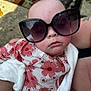 arms, baby, blanket, carpet, child, closeup, comfort, cute, face, floral_outfit, infant, outdoor, pattern, peaceful, person, resting, skin, sleeping, sunglasses, wearing