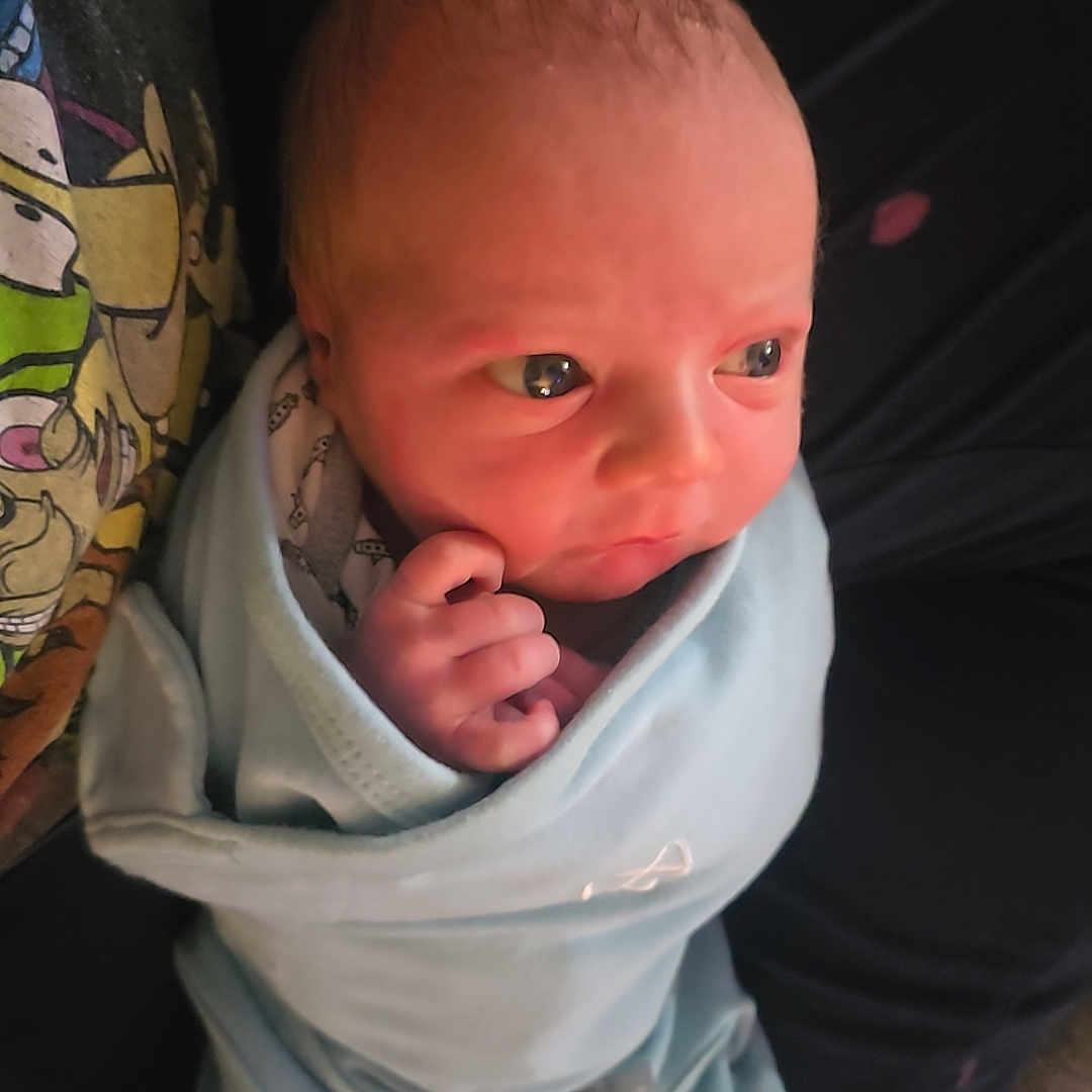 Octavio joined the competition — help win amazing prizes! baby, blanket, bodypart, bonnet, clothing, couch, face, finger, hand, hat, head, hood, hoodie, knitwear, newborn, person, photography, portrait, sweater, sweatshirt