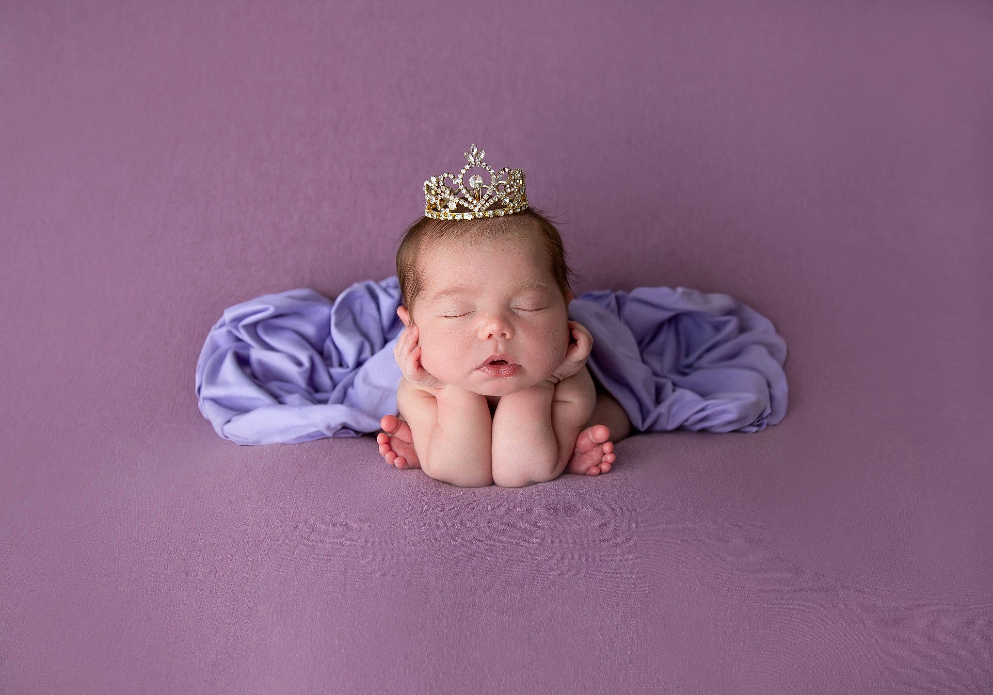 Maya is registered to the contest to win money with this photo: baby, baby_toddler_clothing, cap, child, comfort, costume_hat, crown, finger, flash_photography, font, hair_accessory, happy, headband, headgear, headpiece, jewellery, person, purple, sleeve, toddler