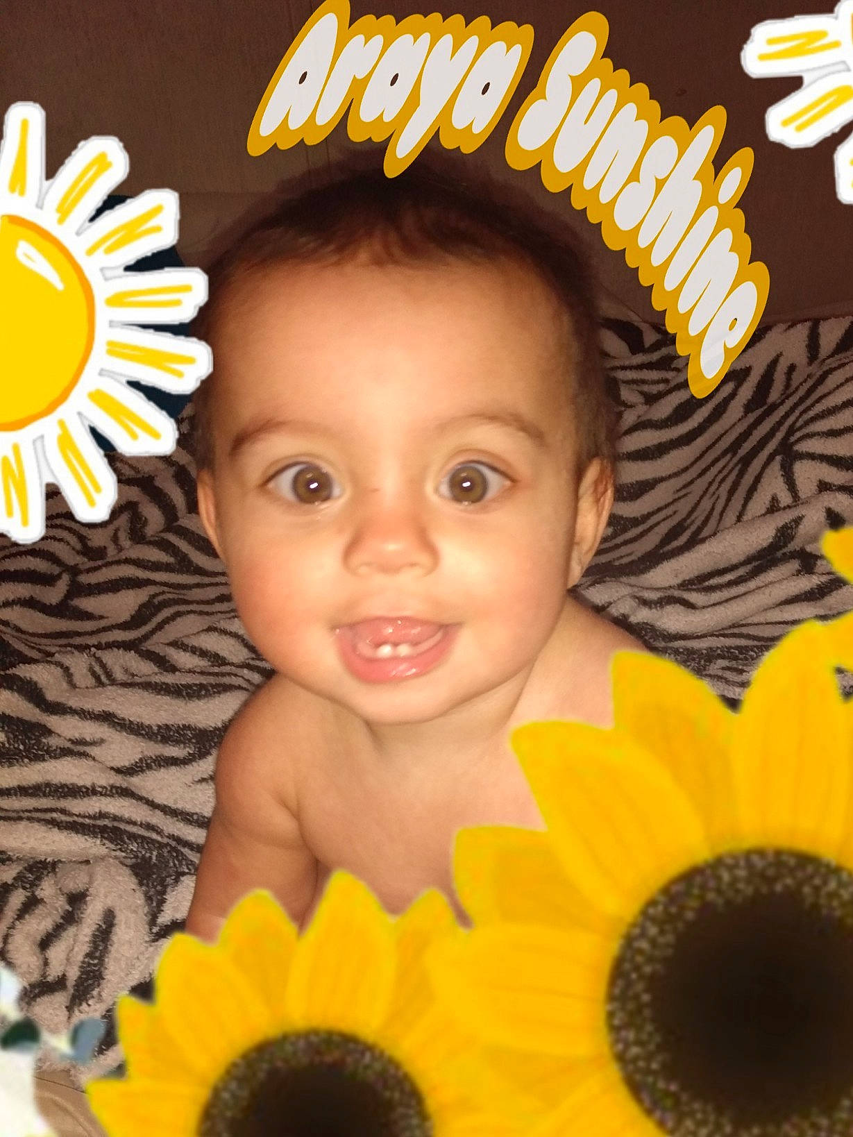 Araya is registered to the contest to win money with this photo: baby_toddler_clothing, beauty, child, close_up, eyelash, facial_expression, flower, font, fun, hairstyle, happy, joy, logo, orange, organ, person, petal, photo_caption, smile, sweetness