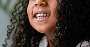 Kasey Gutierrez joined the competition — help win amazing prizes! child, smile, curly_hair, face, portrait, white_shirt, red_hearts, happy, close_up, person, youth, cute, expression, natural_light, skin, eyelashes, nostrils, background_blur, indoors, casual_clothing