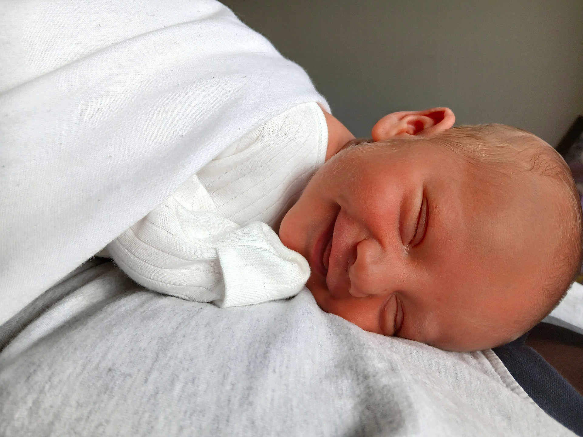 Flynn joined the competition — help win amazing prizes! baby, sleeping, white_clothing, blanket, closeup, infant, soft_texture, peaceful, portrait, rest, skin, face, head, newborn, cute, indoors, relaxation, smile, child, tender
