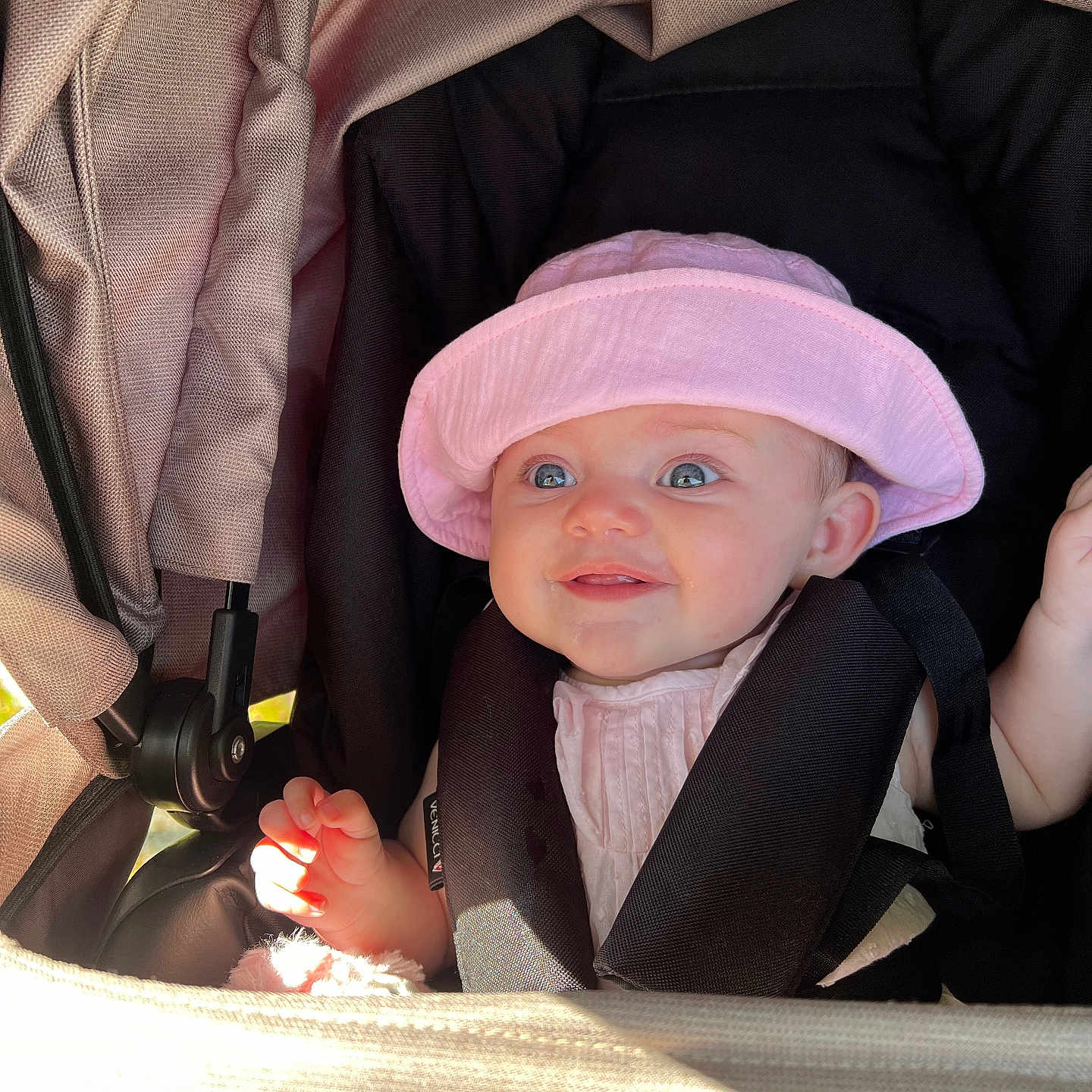 Amelia is registered to the contest to win money with this photo: accessories, baby, bodypart, bonnet, cap, car, clothing, coat, face, finger, hand, hat, head, jacket, newborn, person, photography, portrait, stroller, sunhat