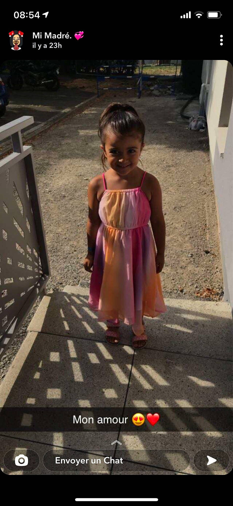 Mélina participe au concours pour gagner de l'argent avec cette photo : asphalt, child, dress, flooring, foot, fun, human_leg, joy, magenta, pedestrian, person, road, road_surface, sandal, shadow, sidewalk, sitting, smile, street, toddler