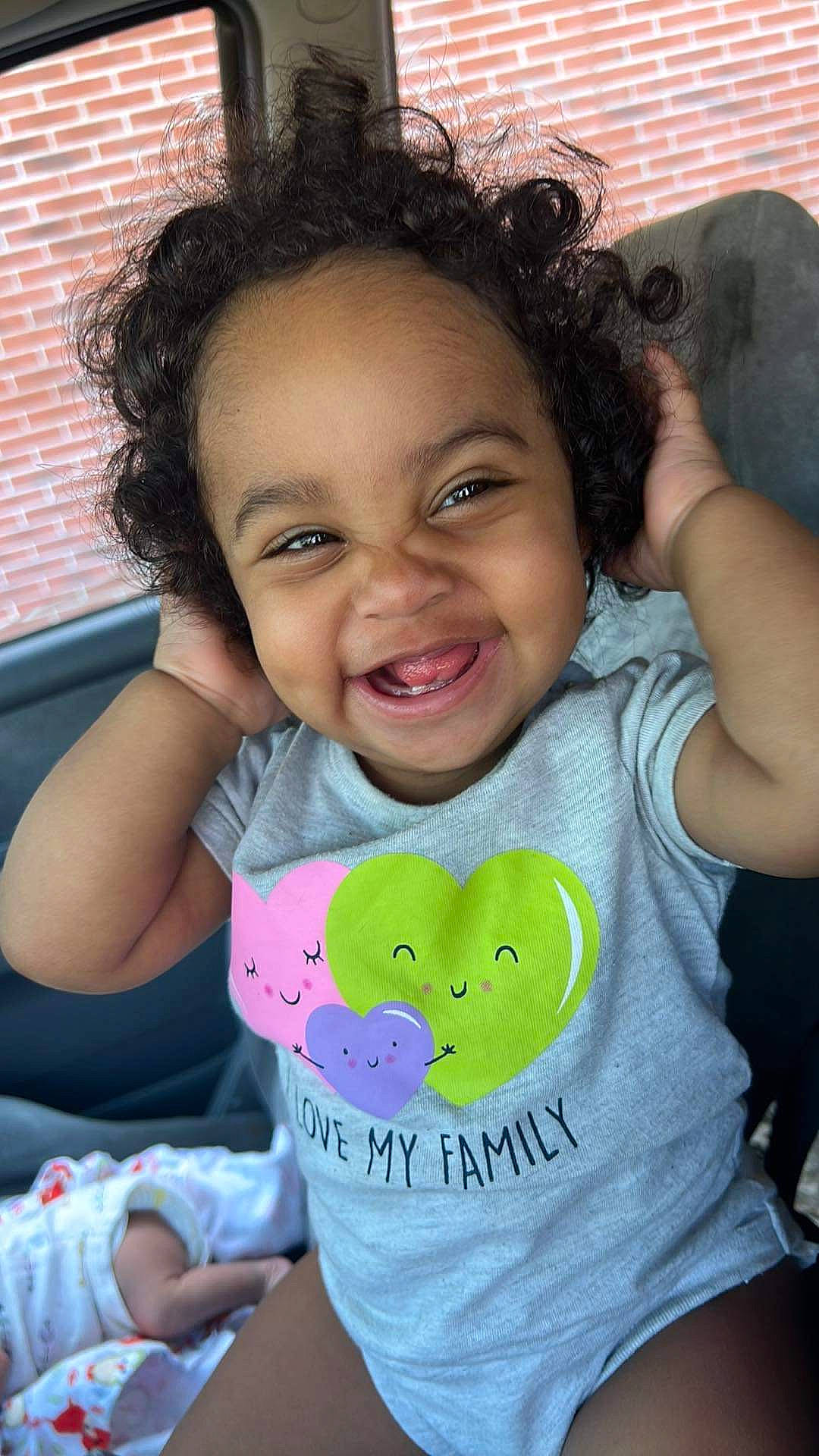 Kayliana is registered to the contest to win money with this photo: baby_toddler_clothing, blue, cheek, chin, eye, face, facial_expression, gesture, hairstyle, happy, head, iris, joy, lip, mouth, nose, organ, person, skin, sleeve