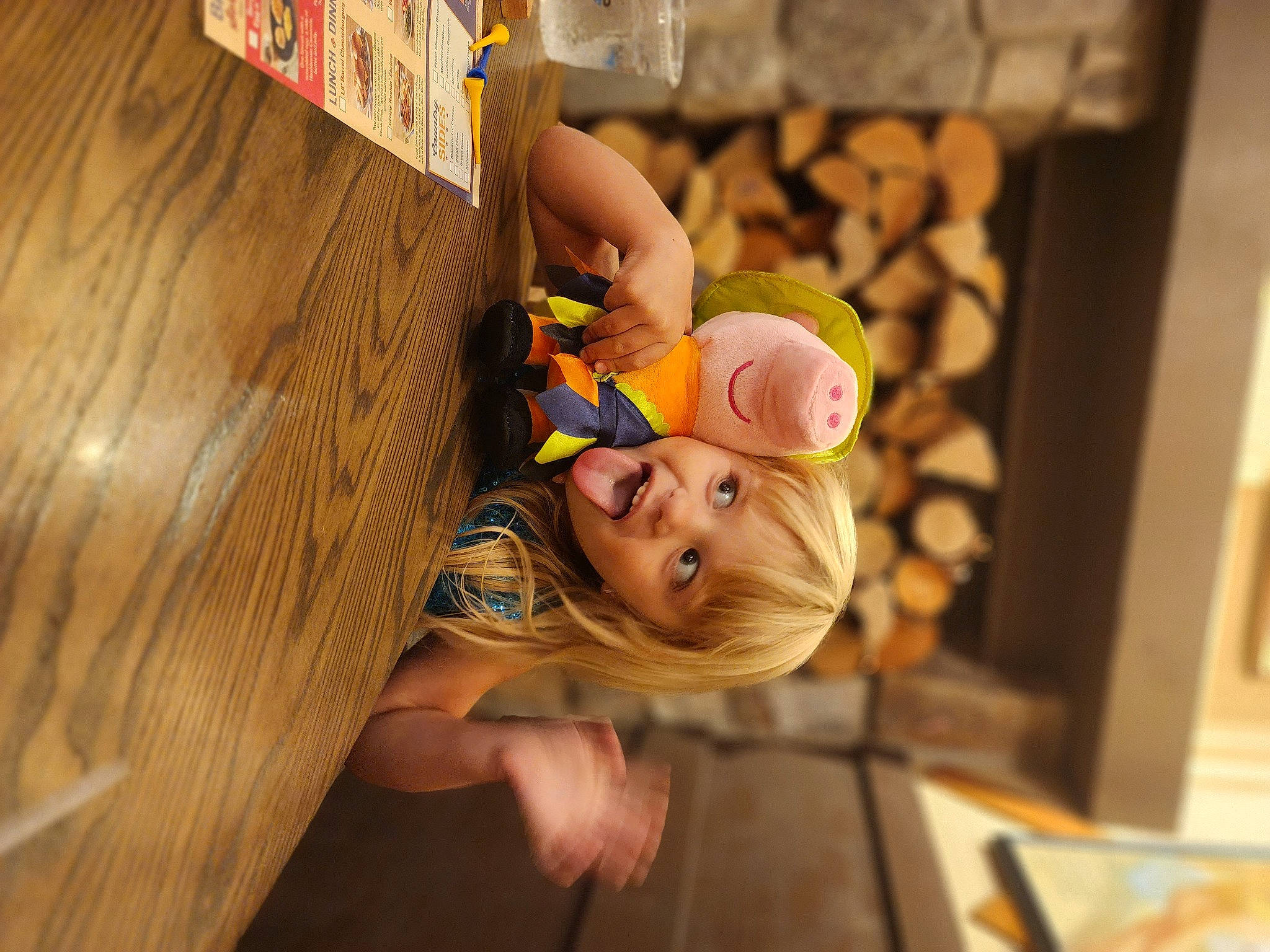 Isabella is registered to the contest to win money with this photo: baby, baby_toddler_clothing, child, flooring, fun, happy, hardwood, leisure, person, play, plywood, room, sitting, toddler, tree, varnish, window, wood, wood_stain