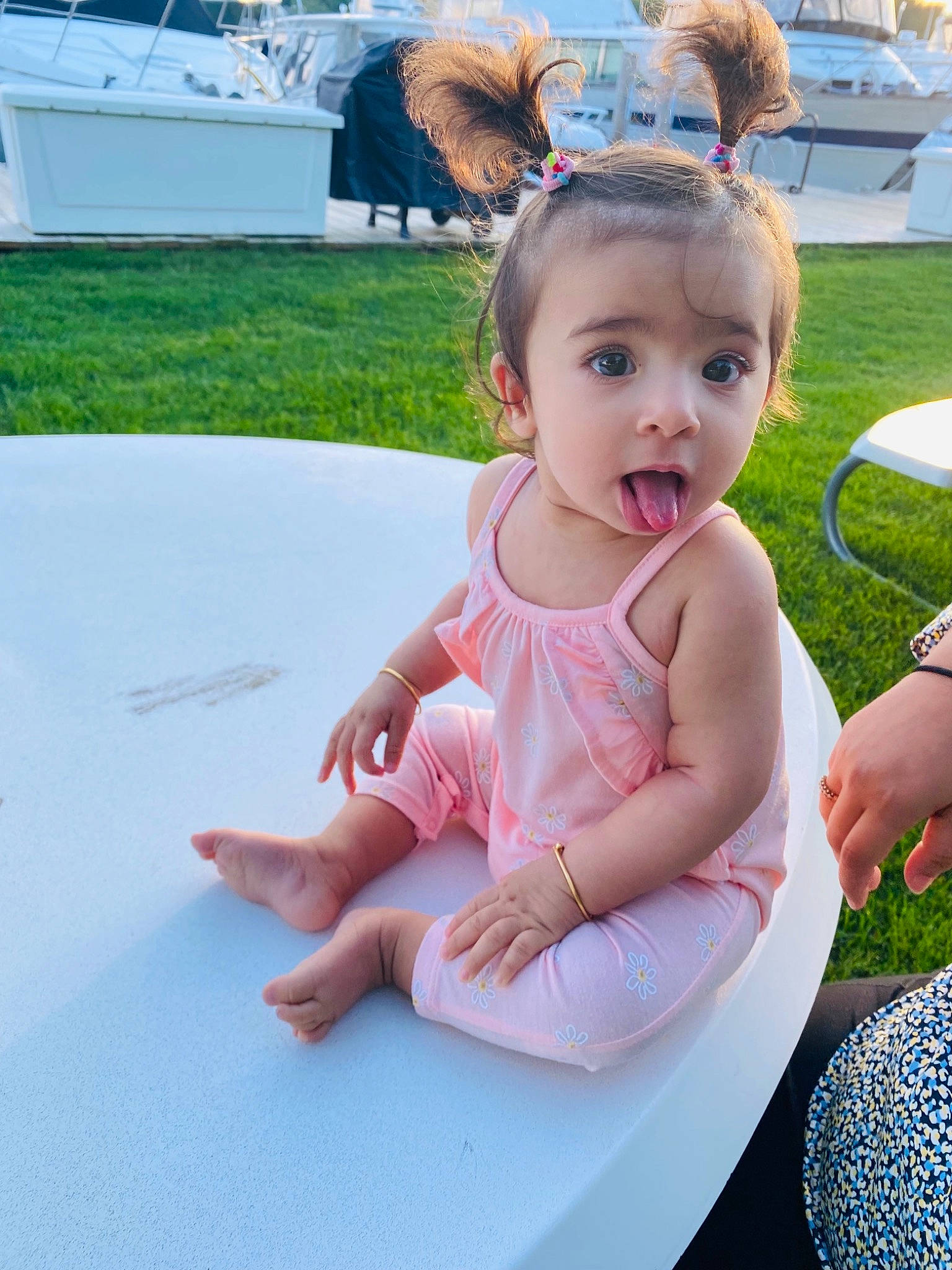 Nia is registered to the contest to win money with this photo: baby, baby_toddler_clothing, barefoot, chair, child, event, foot, fun, grass, happy, human_leg, jewellery, leg, leisure, person, recreation, sitting, skin, summer, surprise