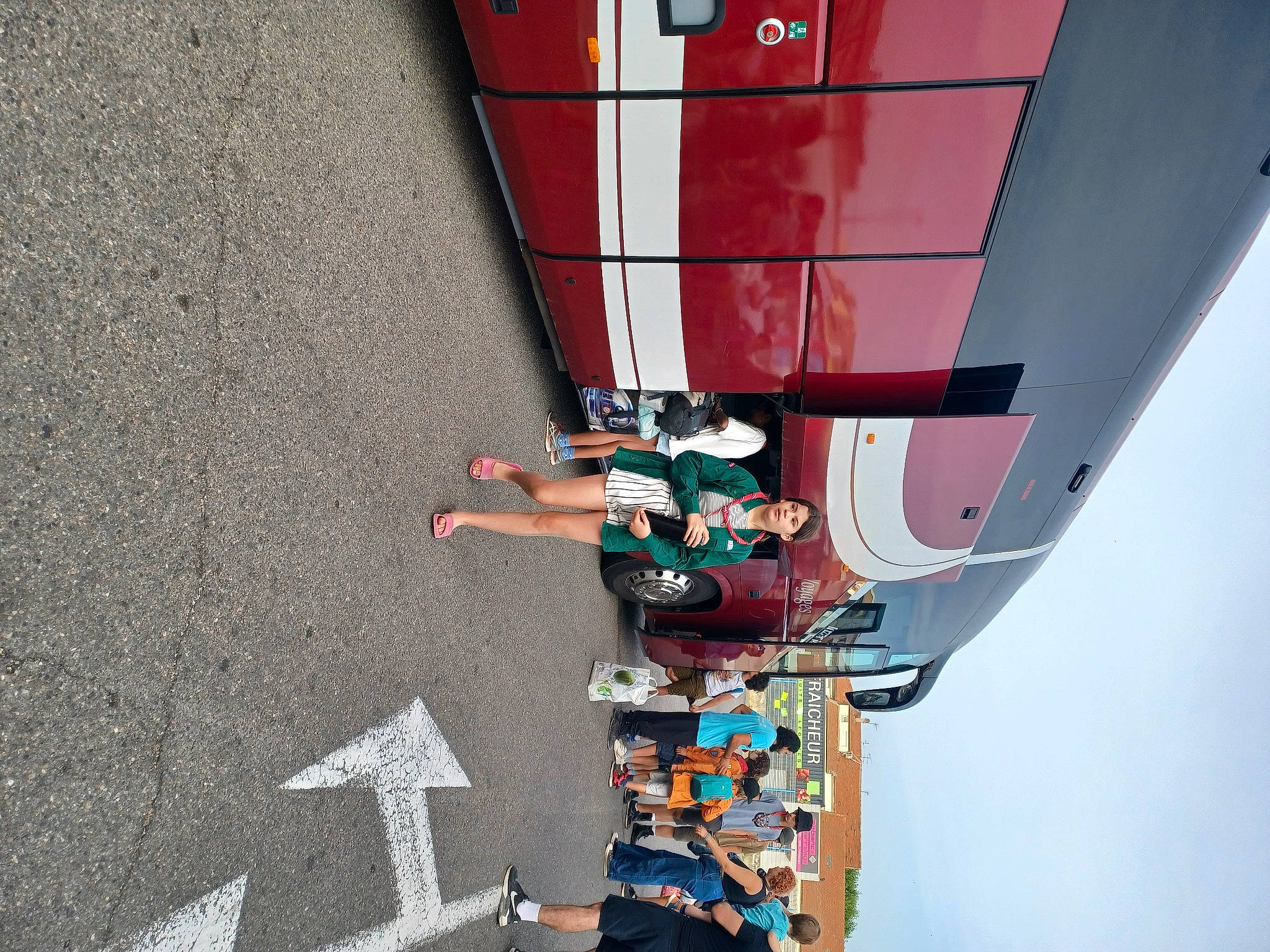 Clara participe au concours pour gagner de l'argent avec cette photo : asphalt, carmine, facade, fun, human_leg, leg, line, machine, outdoor_shoe, pedestrian, person, recreation, road, shadow, street, street_fashion, thigh, transport, vehicle, walking_shoe