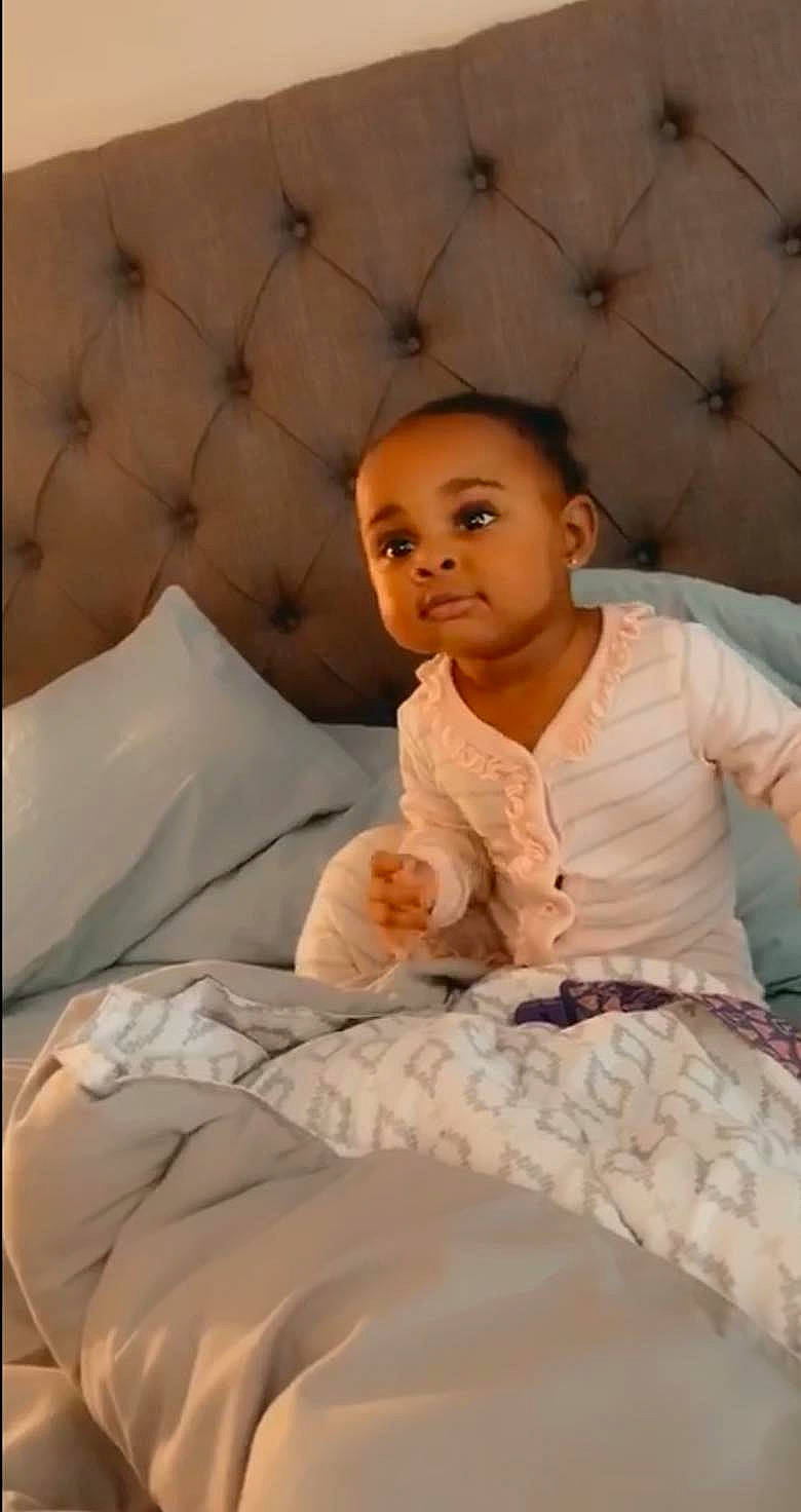 Lailani is registered to the contest to win money with this photo: baby, bed, bedding, child, comfort, furniture, person, sitting, textile, toddler