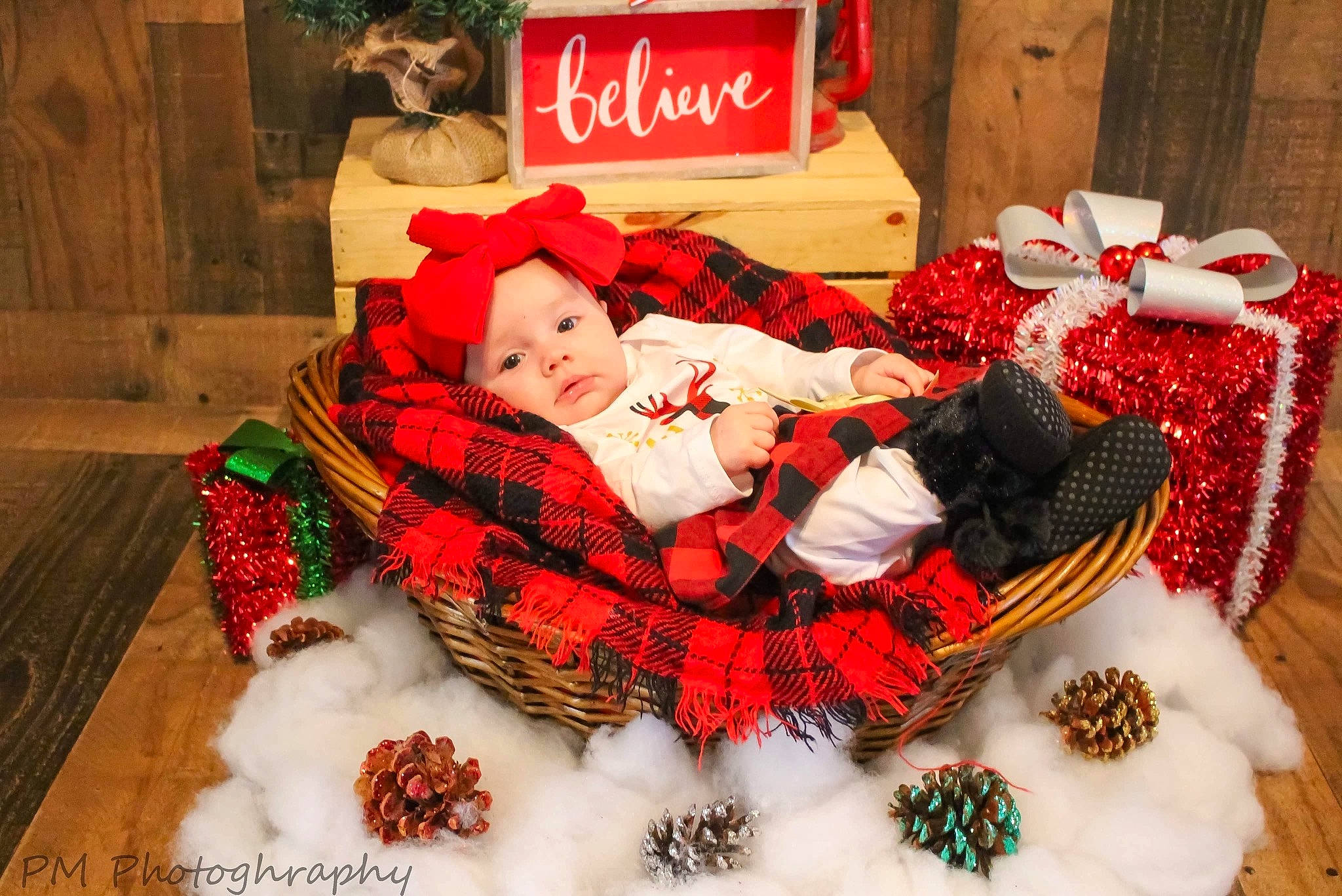 Adrienne is registered to the contest to win money with this photo: baby, baby_toddler_clothing, christmas, christmas_decoration, christmas_eve, craft, headwear, holiday, natural_material, ornament, pattern, person, plaid, red, sock, stuffed_toy, tartan, teddy_bear, textile, winter