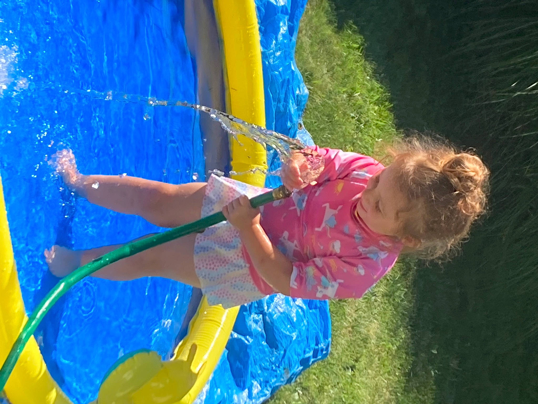 Alaiya joined the competition — help win amazing prizes! blue, boats_and_boating_equipment_and_supplies, child, electric_blue, fun, grass, happy, inflatable, leisure, outdoor_play_equipment, person, play, recreation, shorts, swimming_pool, toddler, tree, water