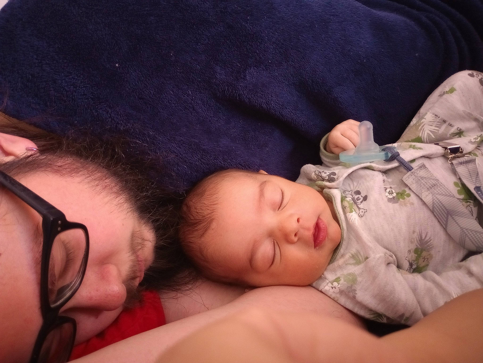 Asher is registered to the contest to win money with this photo: baby, baby_products, baby_sleeping, baby_toddler_clothing, bedtime, cheek, child, comfort, ear, eyelash, gesture, glasses, lip, mouth, nap, nose, pattern, person, skin, sleep