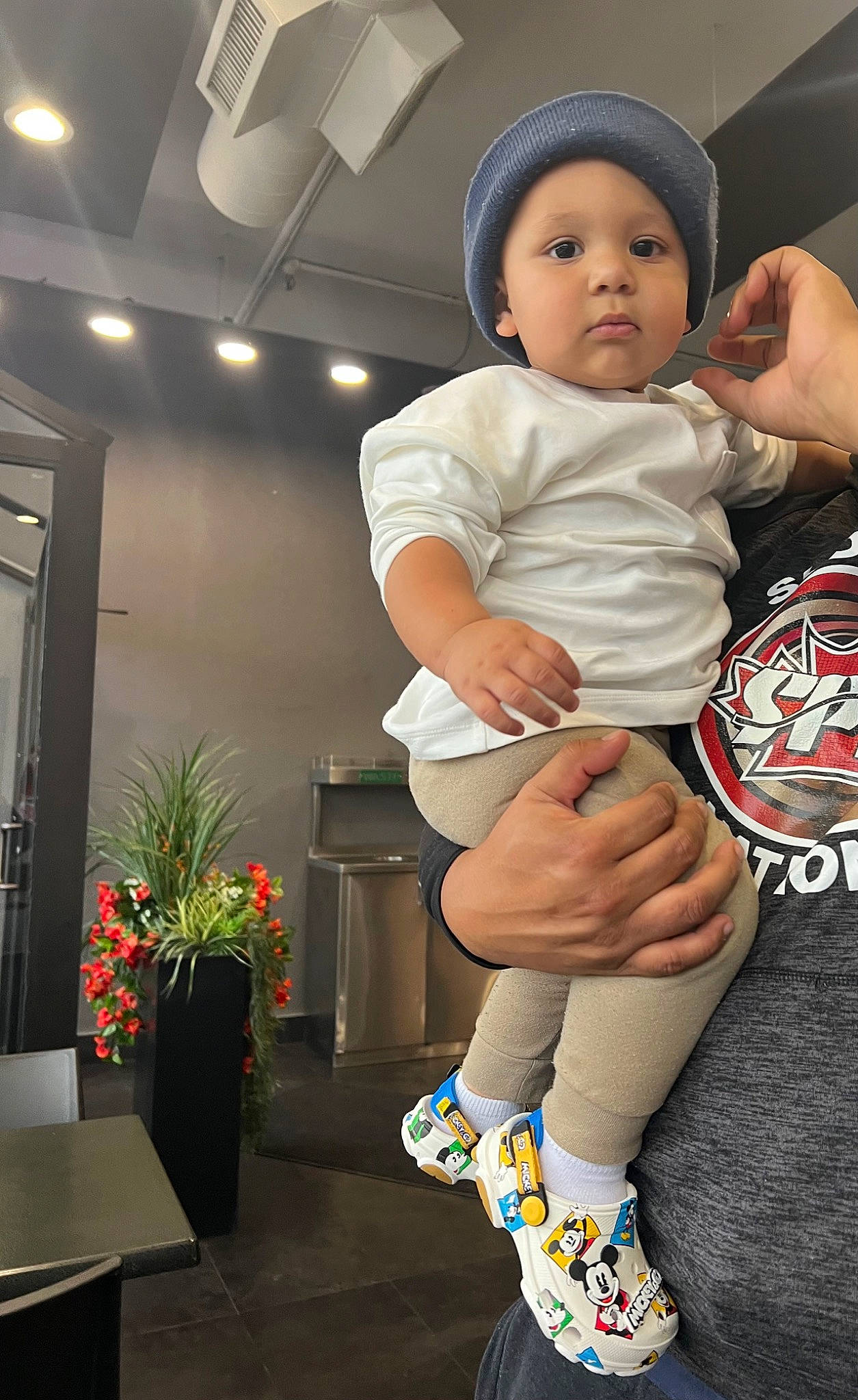 Kairo joined the competition — help win amazing prizes! baby, baby_toddler_clothing, child, finger, flooring, flowerpot, foot, fun, happy, headwear, houseplant, human_leg, knee, person, plant, sitting, sleeve, sock, sportswear, thigh
