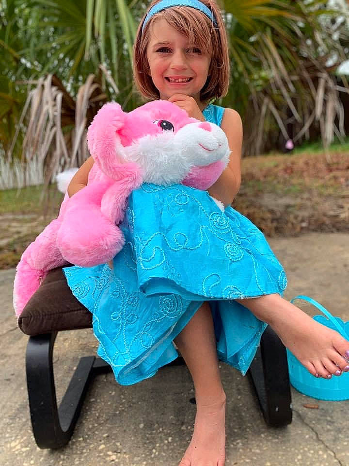 Evangeline is registered to the contest to win money with this photo: azure, blue, electric_blue, fawn, grass, happy, human_leg, joy, magenta, person, pink, plant, rabbit, sandal, shoe, skin, smile, stuffed_toy, summer, toy