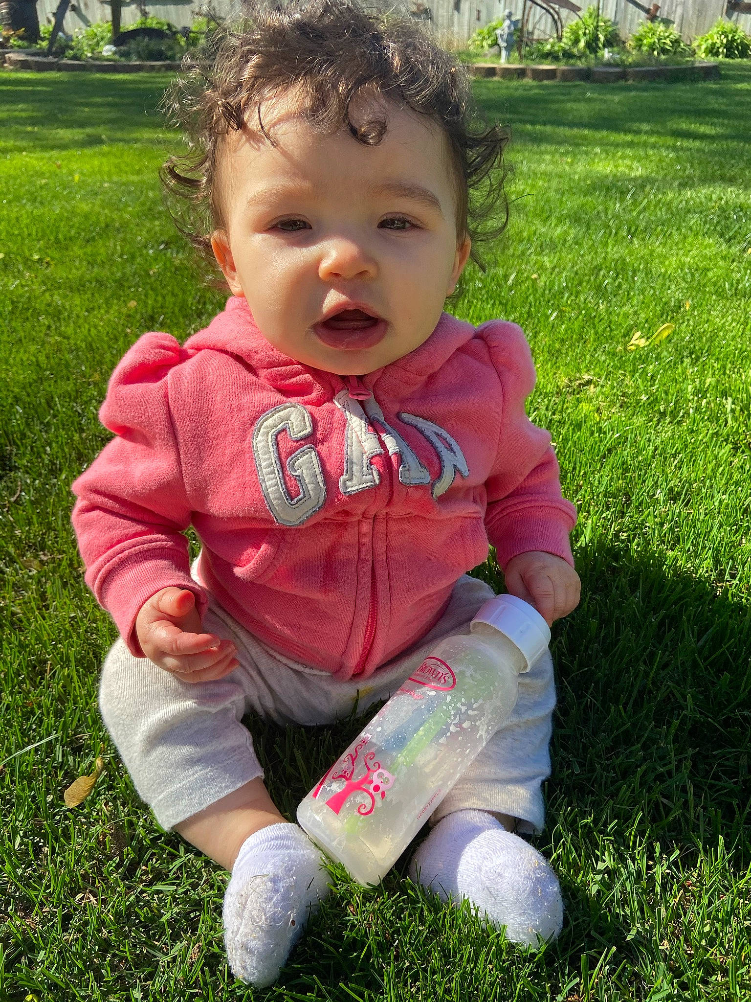 Charliegh joined the competition — help win amazing prizes! baby, baby_toddler_clothing, cheek, child, fun, garden, grass, grassland, green, groundcover, happy, lawn, meadow, people_in_nature, person, plant, sitting, sleeve, soil, toddler