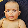 Kingston is registered to the contest to win money with this photo: baby, blue_eyes, child, cute, face, hair, head, infant, mohaawk, person, portrait, skin, sitting, smile, young, indoors, cushion, background, closeup, expression