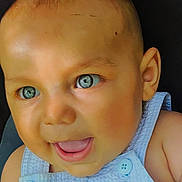 Kingston is registered to the contest to win money with this photo: baby, closeup, face, smile, blue_eyes, child, infant, skin, button, clothing, portrait, happy, cute, cheerful, eyebrows, ear, mouth, tongue, expression, background
