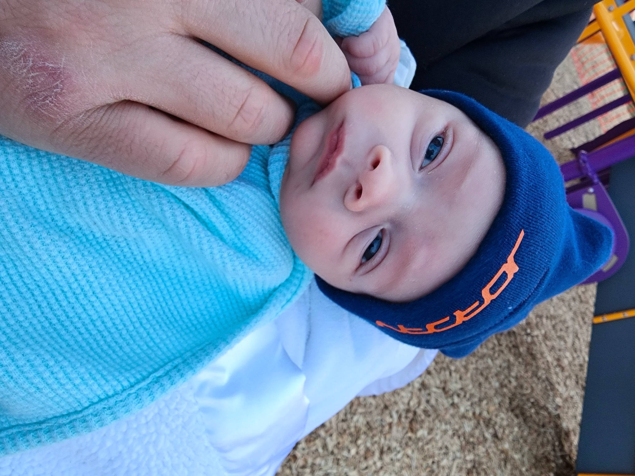 Kash is registered to the contest to win money with this photo: azure, baby, baby_products, baby_toddler_clothing, blue, cheek, child, electric_blue, gesture, grass, happy, hat, headwear, nail, nose, person, skin, smile, thumb, toddler