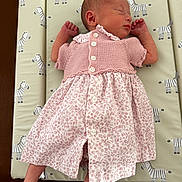 Clover joined the competition — help win amazing prizes! newborn, baby, sleeping, pink_dress, knitwear, patterned_fabric, zebra_pattern, infant, cute, peaceful, resting, child, portrait, indoor, soft_lighting, small_hands, small_feet, baby_clothes, cozy, nursery