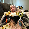Kaisyn joined the competition — help win amazing prizes! baby, infant, headband, baby_seat, toy, colorful, indoor, couch, child, cute, soft_toys, clothing, play, smile, young_child, seat, fabric, patterned, home, furniture