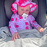baby, blanket, car_seat, child, comfort, cute, hat, headwear, infant, outdoor, pacifier, patterned_clothing, pink_clothing, portrait, relaxing, seat, small_hand, sun_hat, sunlight, young_child