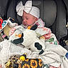 baby, infant, car_seat, headband, bow, blanket, stuffed_toy, plush, sleeping, child, accessory, soft_toy, graco, cozy, cute, floral_pattern, sunflower, toy, comfort, peaceful