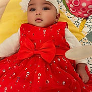 Maylana a rejoint le concours — aidez-le/la à gagner de superbes lots ! baby, child, red_dress, headband, flower, bow, sparkles, blanket, pattern, toy, infant, cute, lying_down, indoors, soft_toy, colorful, face, person, young_child, closeup