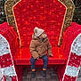 boots, child, christmas, cold_weather, cute, decor, festive, hat, holiday_decorations, jacket, lights, outdoor, pacifier, pavement, red_throne, seat, snowflakes, toddler, tree, winter_clothing