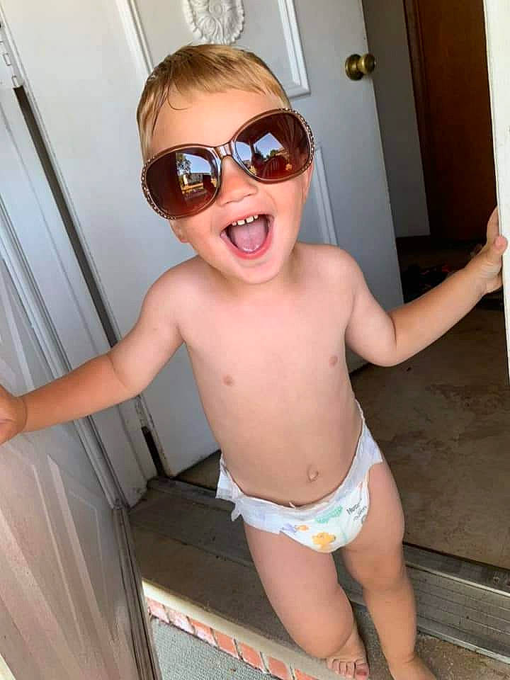Wyatt is registered to the contest to win money with this photo: chest, eyewear, face, glasses, goggles, hair, happy, head, human_body, joint, mouth, neck, person, smile, sunglasses, swimwear, thigh, toddler, trunk, underpants