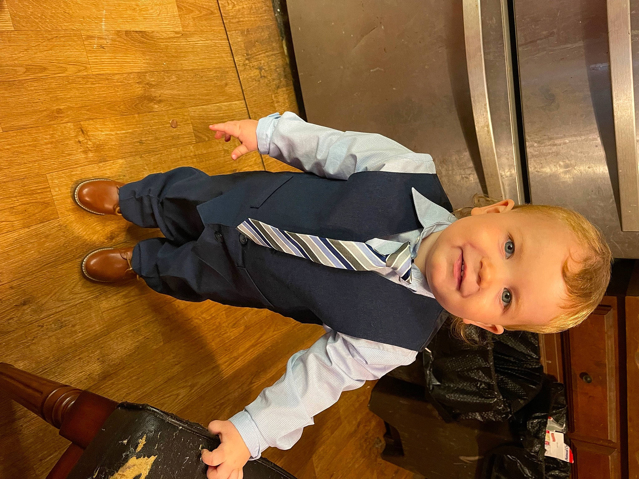Kaiden joined the competition — help win amazing prizes! auto_part, child, flooring, foot, happy, hardwood, human_leg, joint, joy, knee, leg, outdoor_shoe, pattern, person, shoe, sitting, smile, sneakers, sock, toddler