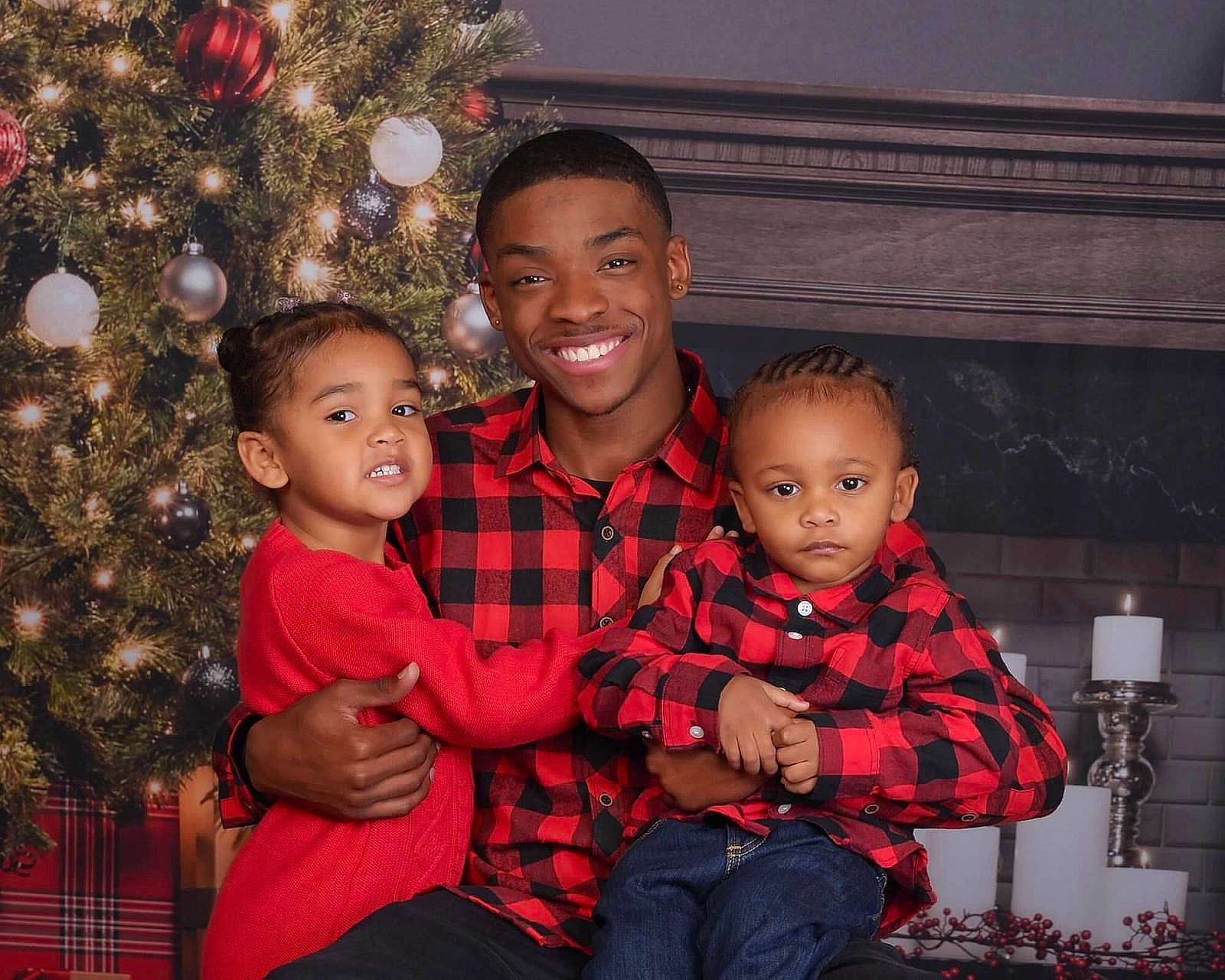 Mylah joined the competition — help win amazing prizes! child, christmas, christmas_decoration, christmas_ornament, christmas_tree, event, flash_photography, fun, happy, holiday, human_body, joy, lap, organ, person, red, sitting, smile, social_group, standing