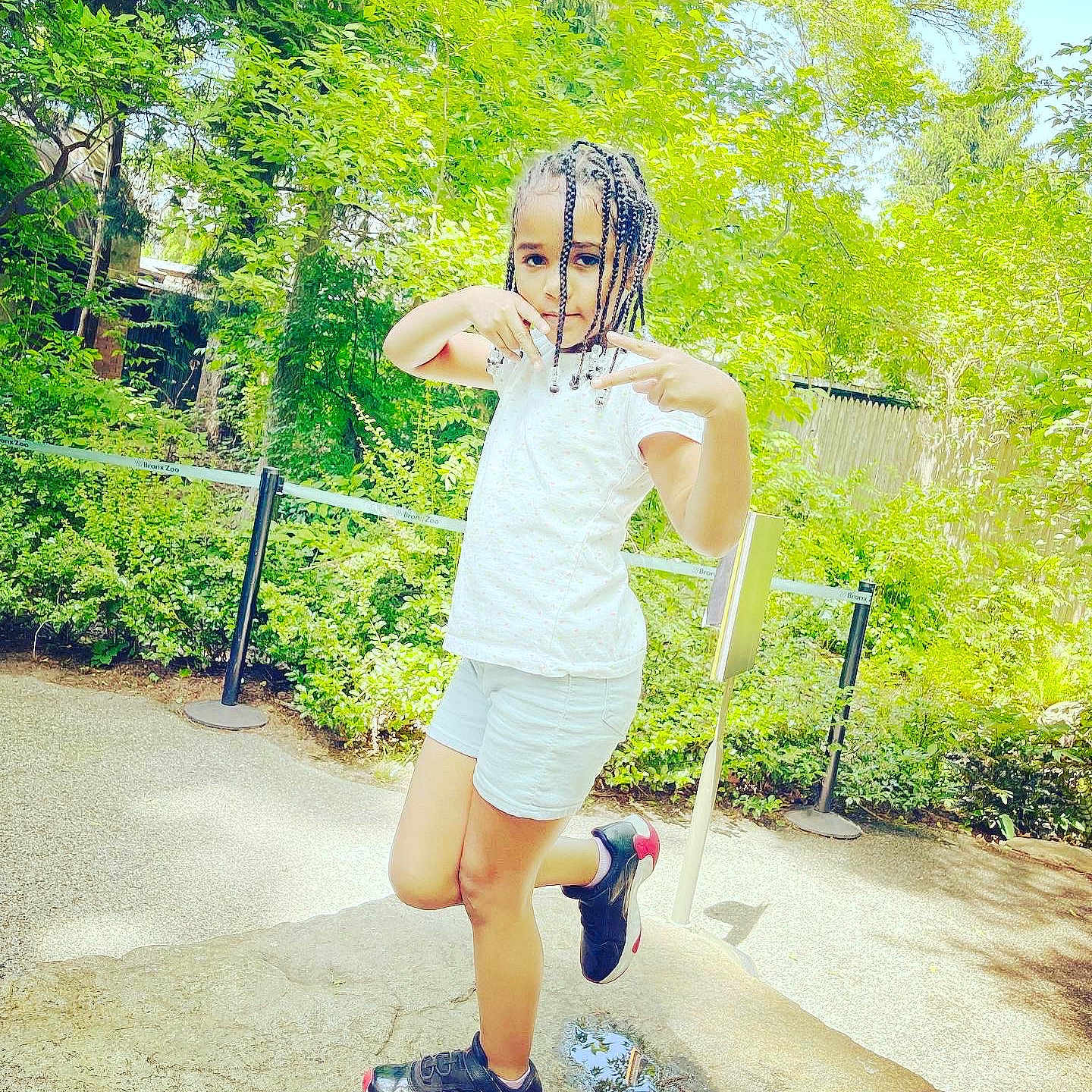 Mylah is registered to the contest to win money with this photo: asphalt, cool, flash_photography, grass, happy, human_leg, knee, leg, leisure, people_in_nature, plant, recreation, shorts, sneakers, street_fashion, summer, sunlight, thigh, tree, waist