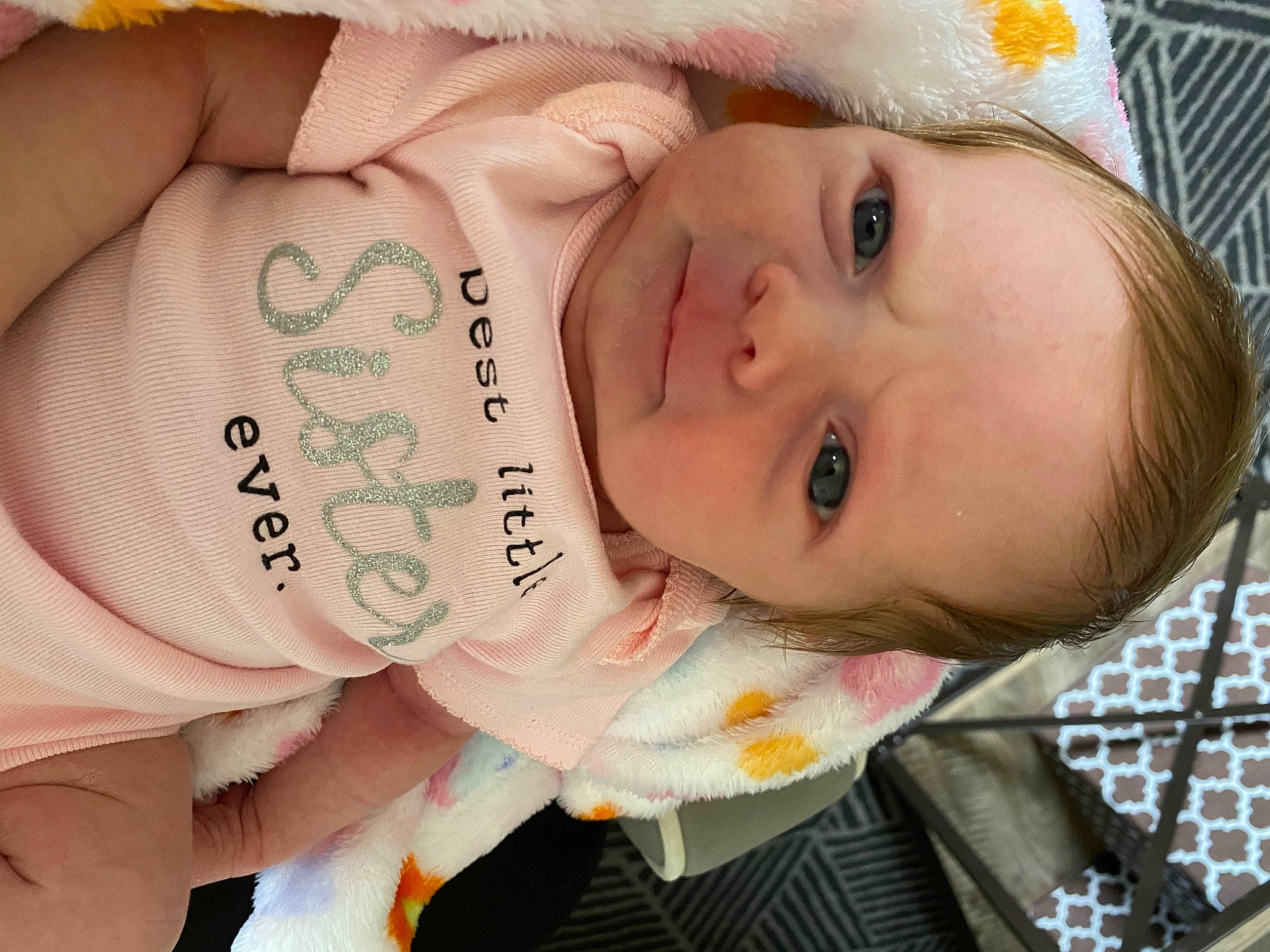 Madelynn is registered to the contest to win money with this photo: baby, baby_products, baby_toddler_clothing, cheek, chest, child, drinkware, eyelash, happy, iris, lip, nail, nose, pattern, person, portrait_photography, skin, thumb, toddler, tree